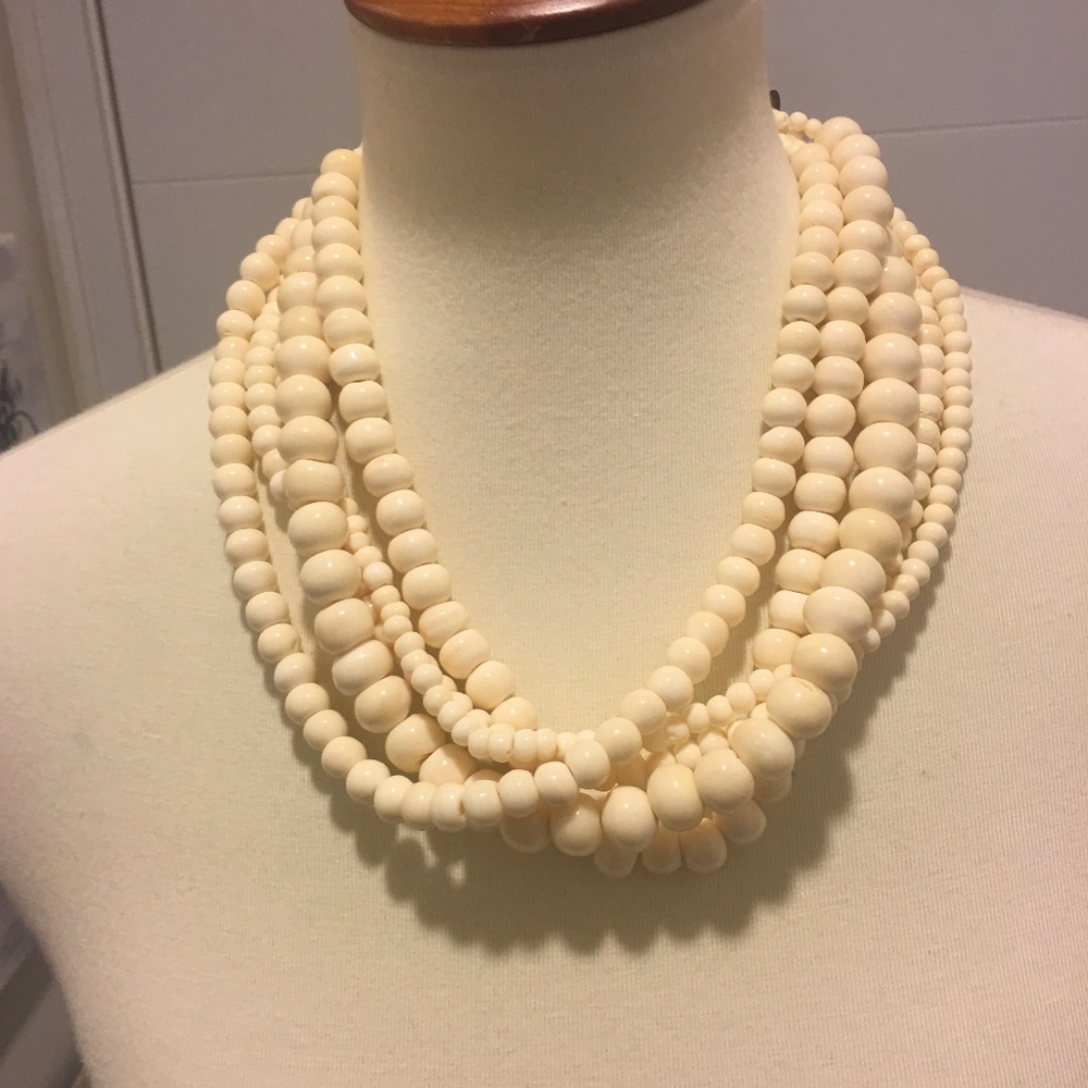 Five strand bone necklace with unique clasp